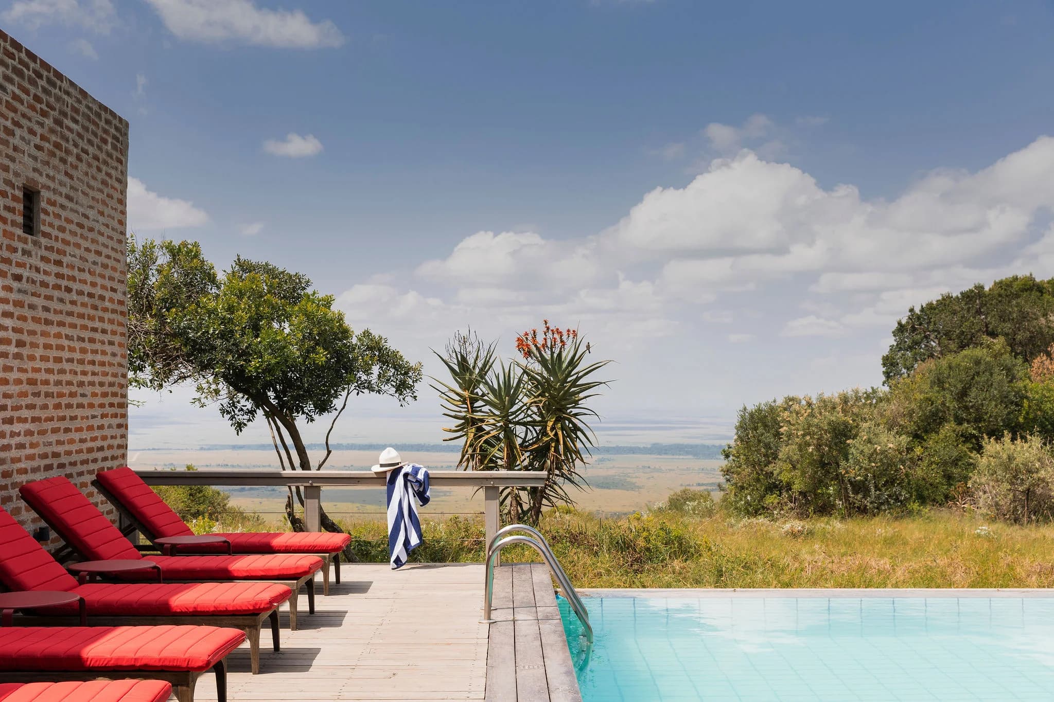 The infinity pool at Angama Mara, overlooking the Great Rift Valley escarpment — Photo: Angama / Teagan Cunniffe