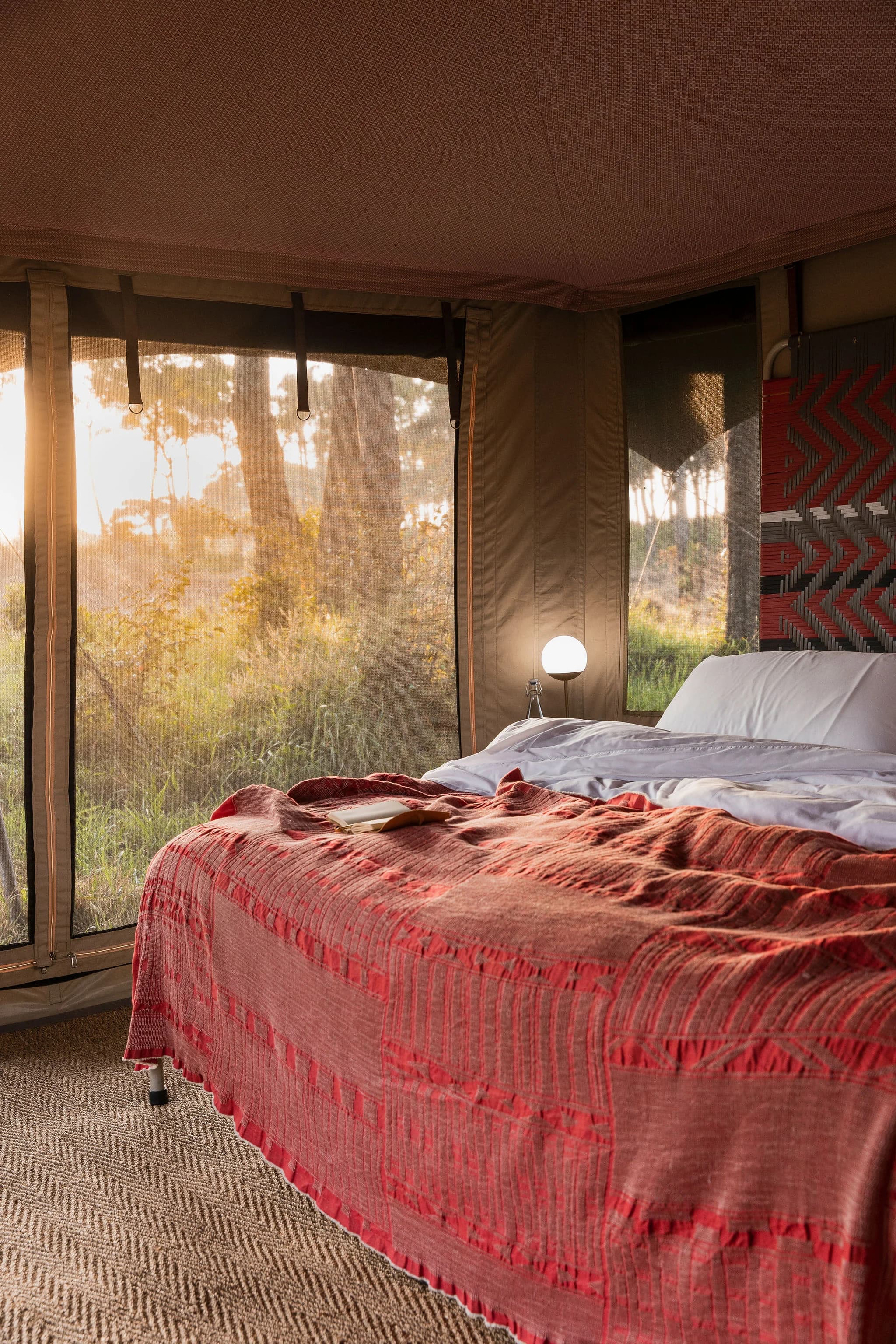 Bed and interior at Angama Safari Camp — Photo: Angama / Teagan Cunniffe