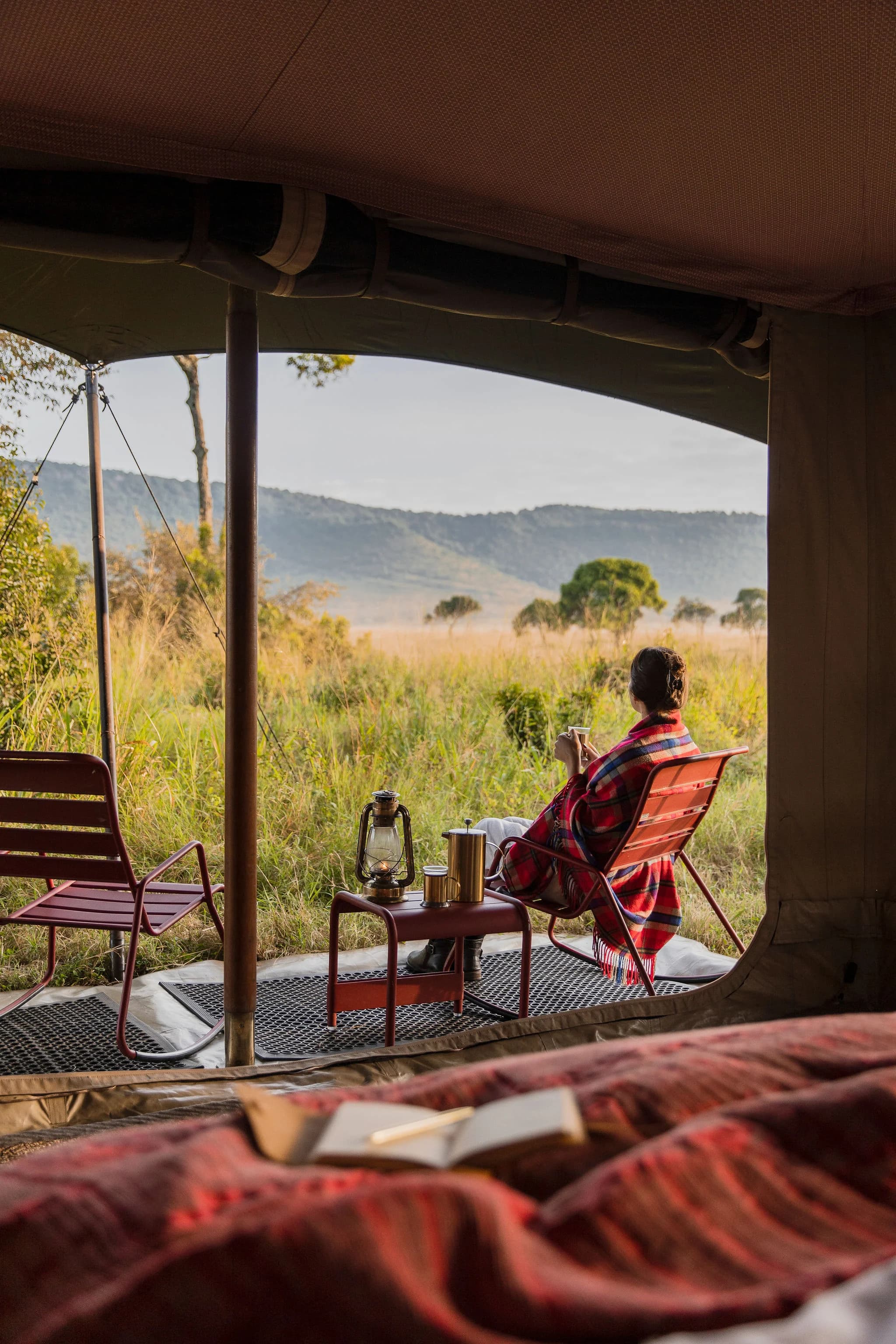 A quiet morning at the threshold — the Mara beyond the canvas — Photo: Angama / Teagan Cunniffe