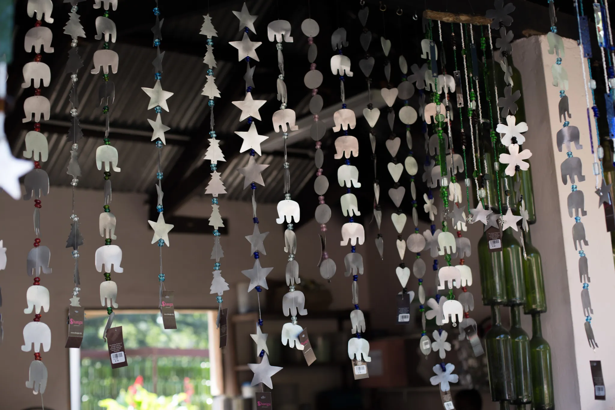 Recycled-glass and beaded ornaments on display at the Shanga workshop — Photo: Elewana Collection