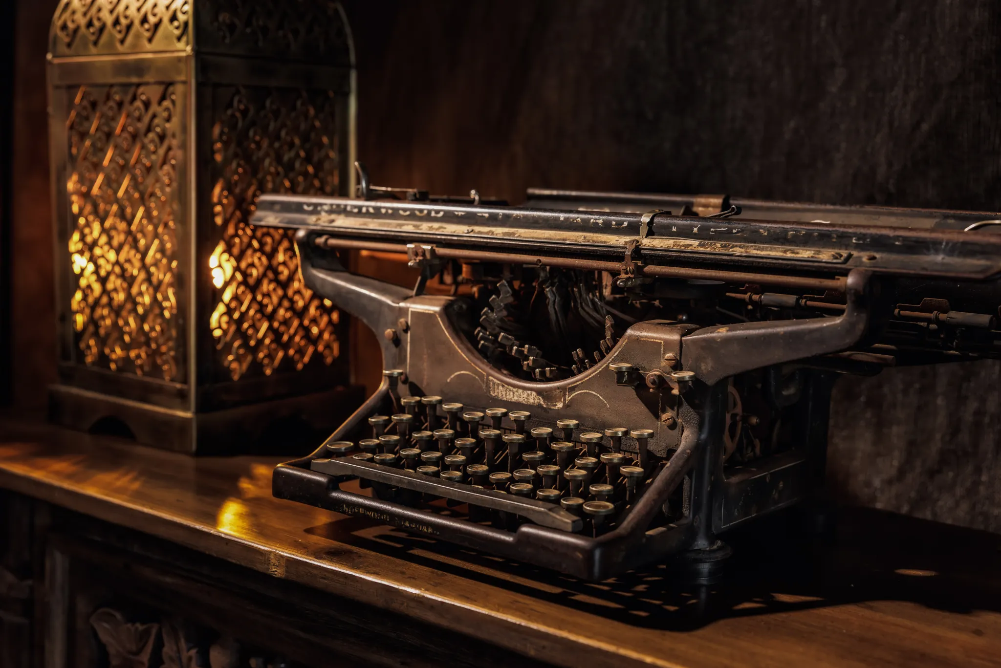 A vintage typewriter and lantern in the mess tent at Elephant Pepper Camp — Photo: Elewana Collection