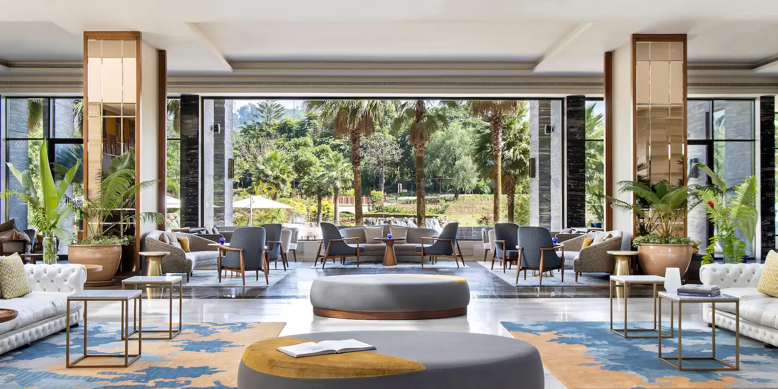The open lobby of Gran Meliá Arusha, framed by gardens