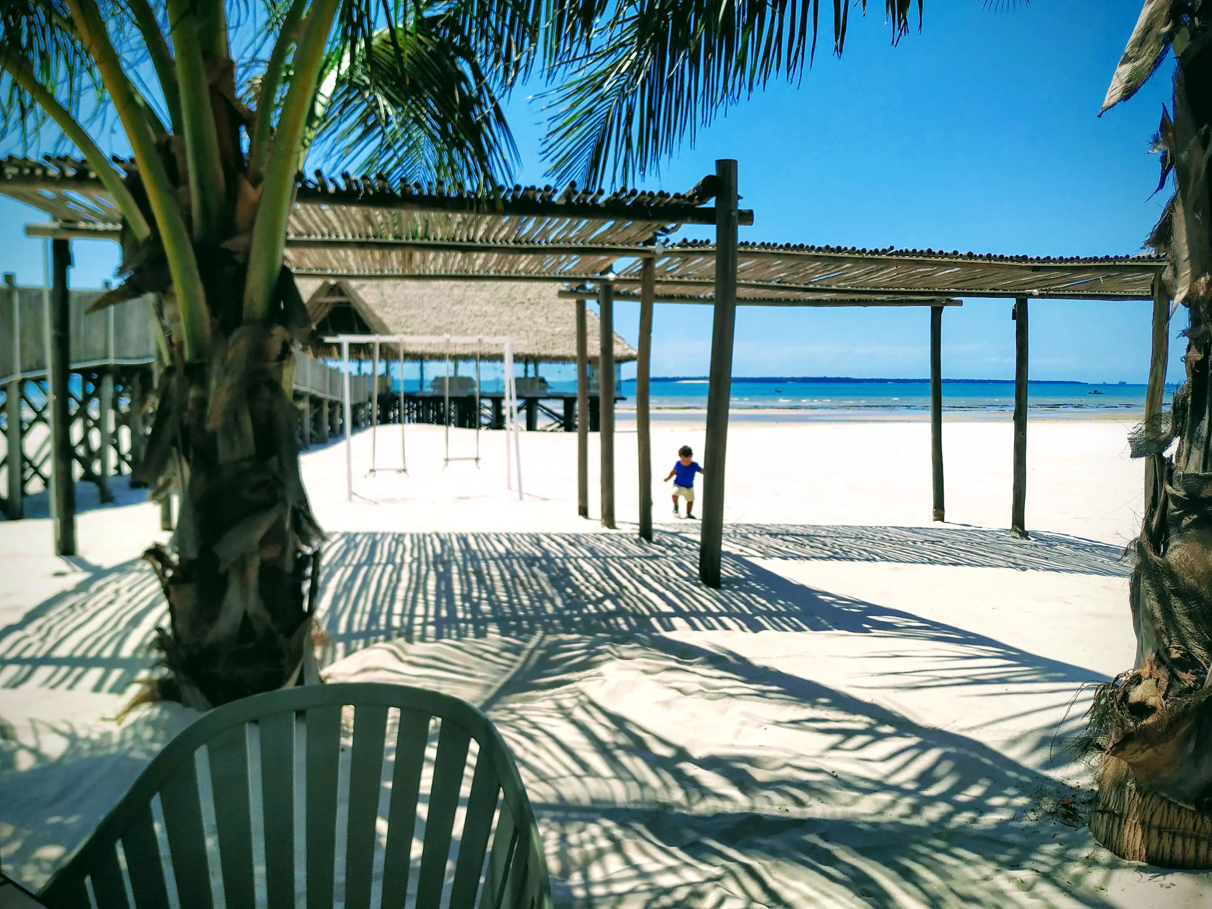 The morning light creating shadows on the pristine shore