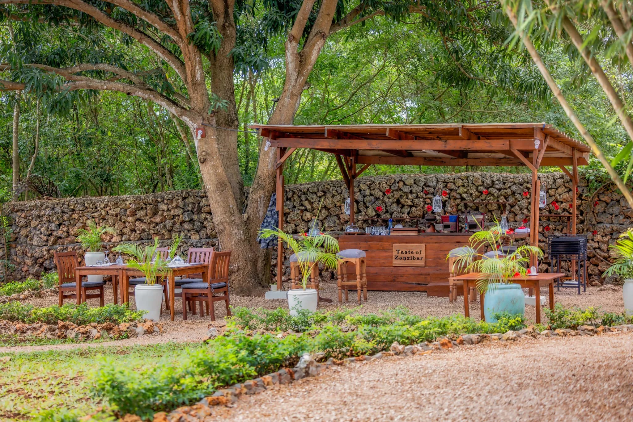 A Swahili dining setup in the gardens at Kilindi Zanzibar — Photo: Elewana Collection