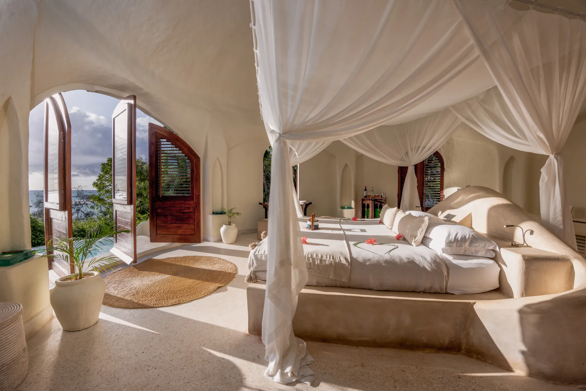 The interior of a beach-facing domed villa at Kilindi Zanzibar, opening to the Indian Ocean — Photo: Elewana Collection